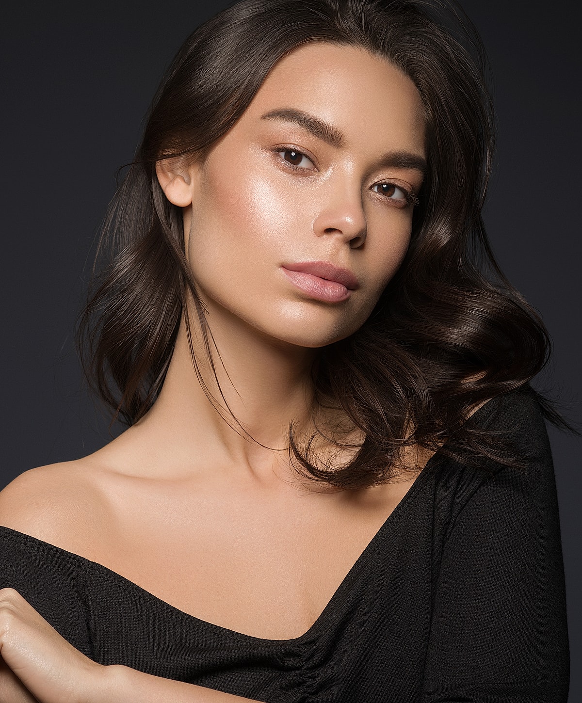 Portrait of a woman with flowing hair.