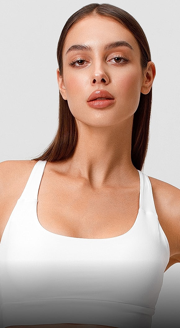 Model wearing a white athletic top.