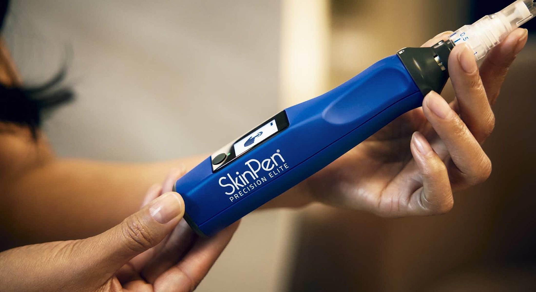 SkinPen Precision Elite microneedling device in hand